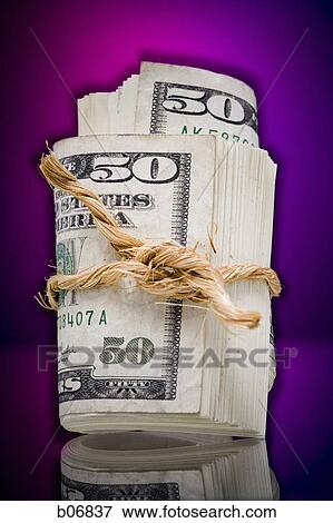 Roll of US bank notes tied with twine View Large Photo Image Stock Photo - Roll of US bank notes tied with twine. Fotosearch