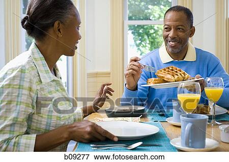 Senior man and a senior woman having breakfast View Large Photo Image Stock Photo - Senior man and a senior woman having breakfast. Fotosearch