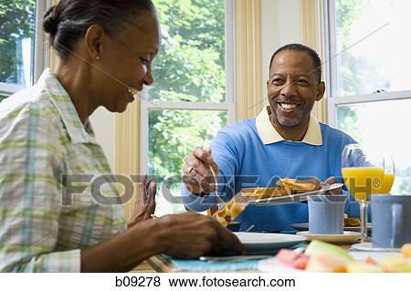Senior man and a senior woman having breakfast View Large Photo Image Stock Photo - Senior man and a senior woman having breakfast. Fotosearch