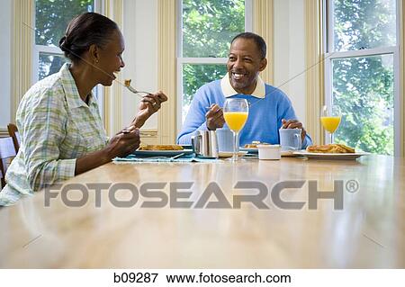 Senior man and a senior woman having breakfast View Large Photo Image Stock Photo - Senior man and a senior woman having breakfast. Fotosearch