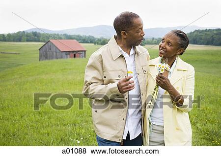 Senior man and a senior woman looking at each other View Large Photo Image Stock Photo - Senior man and a senior woman looking at each other. Fotosearch