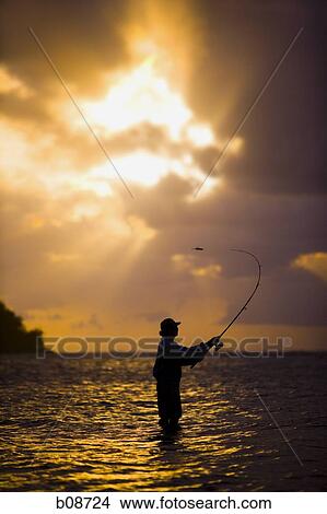 Silhouette of a man fly-fishing View Large Photo Image Picture - Silhouette of a man fly-fishing. Fotosearch