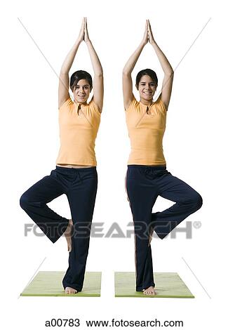 Sisters doing yoga View Large Photo Image Stock Image - Sisters doing yoga. Fotosearch