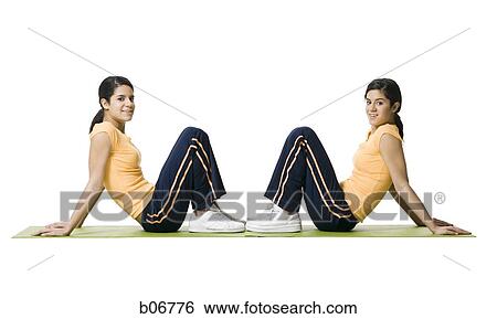 Sisters doing yoga View Large Photo Image Stock Photograph - Sisters doing yoga. Fotosearch