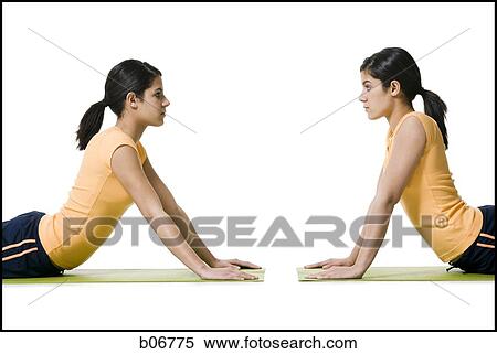 Sisters doing yoga View Large Photo Image Stock Photography - Sisters doing yoga. Fotosearch