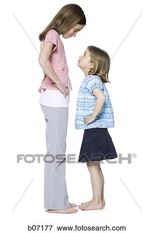 Stock Photo - Sisters in face to face confrontation. Fotosearch
