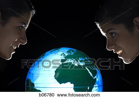Sisters studying earth globe View Large Photo Image Stock Image - Sisters studying earth globe. Fotosearch