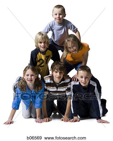 Six children posing in a pyramid and smiling View Large Photo Image Stock Photo - Six children posing in a pyramid and smiling. Fotosearch