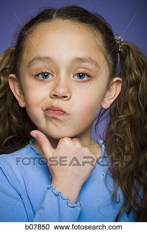 Stock Image - Skeptical young girl. Fotosearch