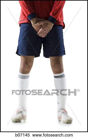 Soccer player holding groin View Large Photo Image Stock Photography - Soccer player holding groin. Fotosearch