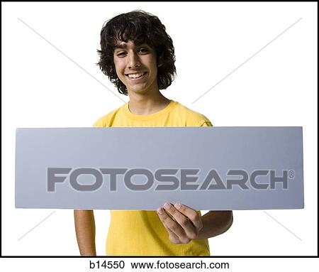 Teenage boy holding blank sign View Large Photo Image Stock Image - Teenage boy holding blank sign. Fotosearch