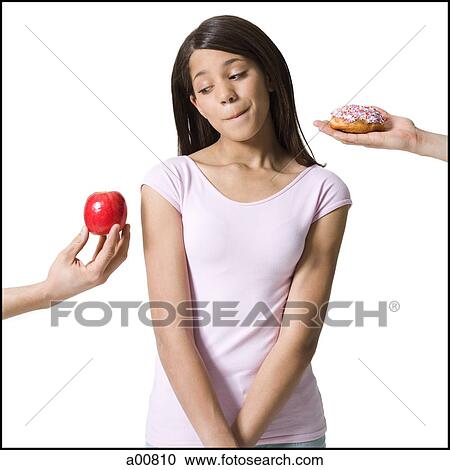 Teenage girl choosing between good and evil View Large Photo Image Stock Image - Teenage girl choosing between good and evil. Fotosearch