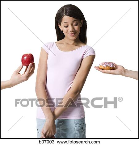 Teenage girl choosing between good and evil View Large Photo Image Stock Image - Teenage girl choosing between good and evil. Fotosearch
