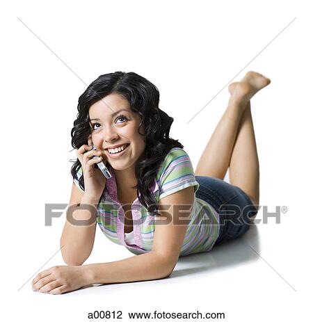 Teenage girl listening on cellphone call View Large Photo Image Stock Image - Teenage girl listening on cellphone call. Fotosearch