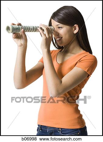 Teenage girl looking through hollow roll View Large Photo Image Stock Photo - Teenage girl looking through hollow roll. Fotosearch
