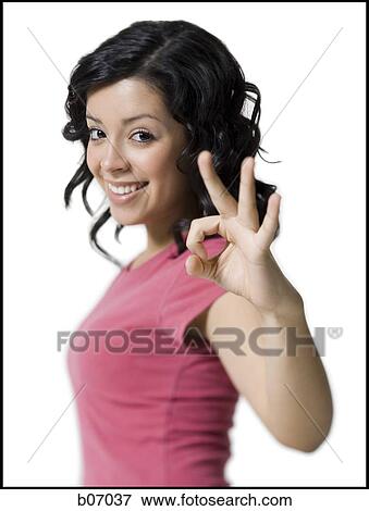 Teenage girl making okay sign View Large Photo Image Stock Photo - Teenage girl making okay sign. Fotosearch