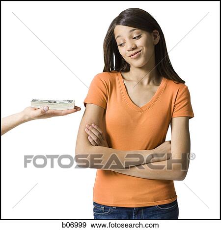 Teenage girl tempted by banknotes View Large Photo Image Stock Photo - Teenage girl tempted by banknotes. Fotosearch