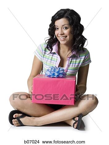 Teenage girl with gift box View Large Photo Image Picture - Teenage girl with gift box. Fotosearch