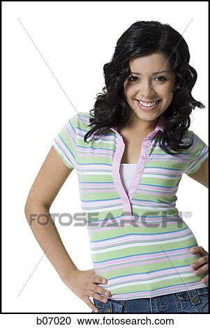 Stock Image - Teenage girl with hand on hip. Fotosearch