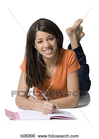 Teenage girl with notebook and earbuds View Large Photo Image Stock Image - Teenage girl with notebook and earbuds. Fotosearch