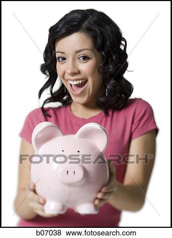 Teenage girl with piggy bank View Large Photo Image Stock Photo - Teenage girl with piggy bank. Fotosearch