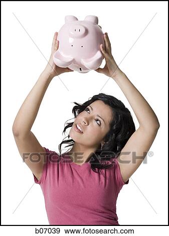 Teenage girl with piggy bank View Large Photo Image Stock Photo - Teenage girl with piggy bank. Fotosearch