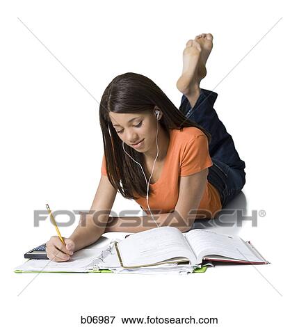 Teenage girl writing in notebook View Large Photo Image Stock Photo - Teenage girl writing in notebook. Fotosearch