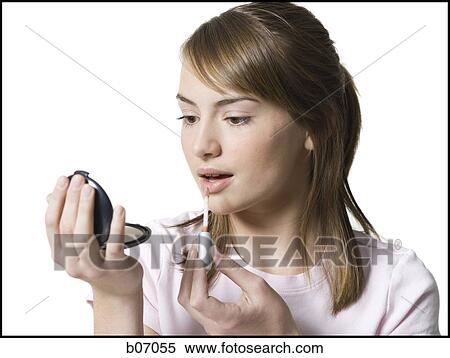 Teenager applying make up View Large Photo Image Stock Photography - Teenager applying make up. Fotosearch