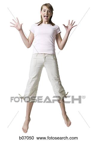 Teenager jumping in the air View Large Photo Image Stock Image - Teenager jumping in the air. Fotosearch