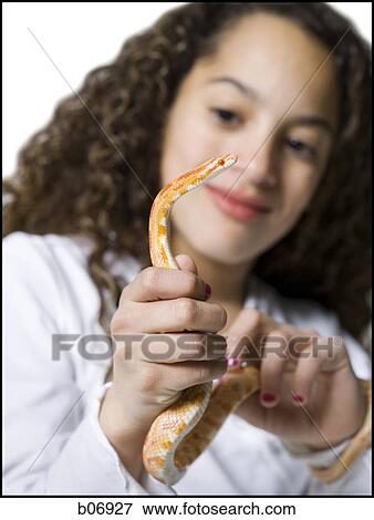 Stock Photo - Teenager with snake. Fotosearch