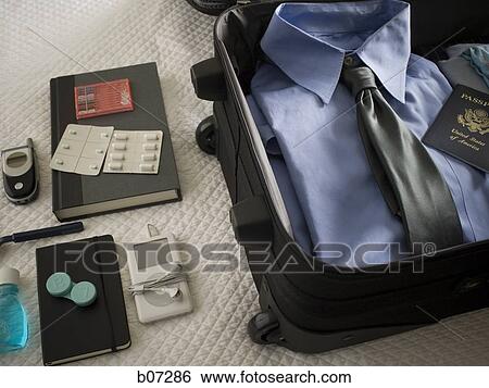 Travelling bag with personal effects View Large Photo Image Stock Photograph - Travelling bag with personal effects. Fotosearch