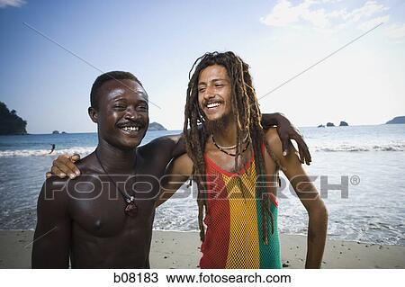 Two black male friends on beach View Large Photo Image Stock Image - Two black male friends on beach. Fotosearch