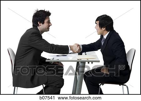 Two businessmen shaking hands View Large Photo Image Stock Image - Two businessmen shaking hands. Fotosearch