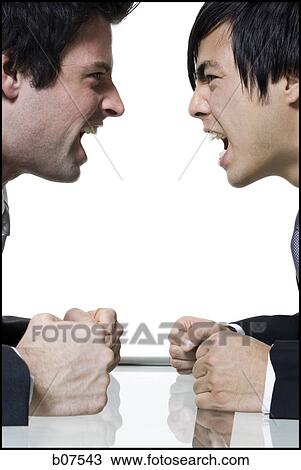 Two businessment arguing with each other View Large Photo Image Stock Image - Two businessment arguing with each other. Fotosearch
