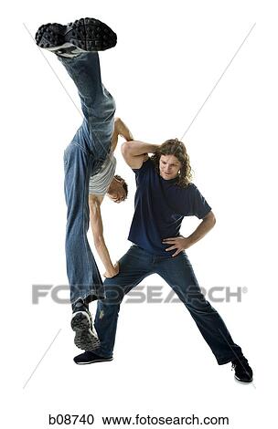 Two young men break dancing View Large Photo Image Stock Image - Two young men break dancing. Fotosearch
