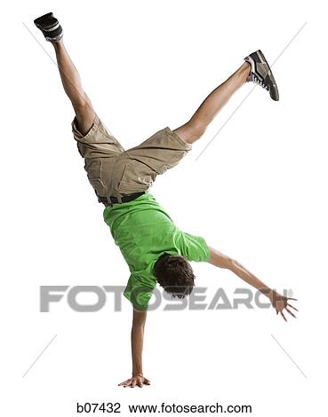 Upside down boy balancing on one hand View Large Photo Image Stock Image - Upside down boy balancing on one hand. Fotosearch