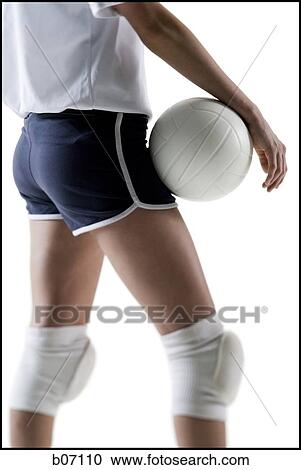 Stock Image - Volleyball player with ball. Fotosearch