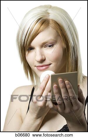Woman applying make up View Large Photo Image Stock Image - Woman applying make up. Fotosearch