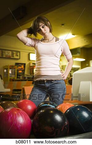 Woman at bowling alley View Large Photo Image Stock Image - Woman at bowling alley. Fotosearch