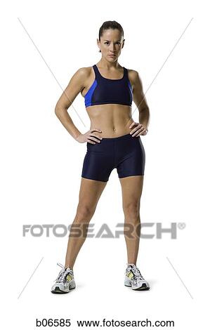 Stock Photography - Woman athlete with hands on hips. Fotosearch