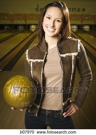 Woman bowling in alley View Large Photo Image Stock Image - Woman bowling in alley. Fotosearch