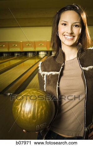 Woman bowling in alley View Large Photo Image Stock Image - Woman bowling in alley. Fotosearch