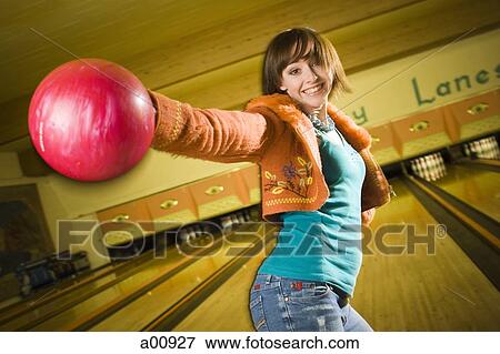 Woman bowling in alley View Large Photo Image Stock Photo - Woman bowling in alley. Fotosearch