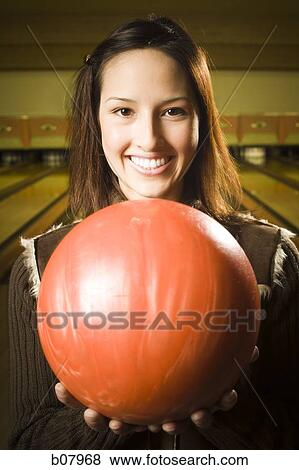 Woman bowling in alley View Large Photo Image Stock Photo - Woman bowling in alley. Fotosearch