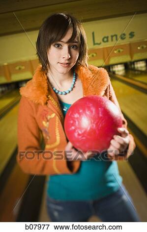 Woman bowling in alley View Large Photo Image Stock Photo - Woman bowling in alley. Fotosearch