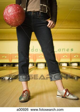 Woman bowling in alley View Large Photo Image Stock Photograph - Woman bowling in alley. Fotosearch