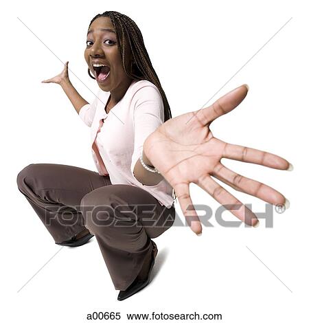 Woman crouching View Large Photo Image Stock Photography - Woman crouching. Fotosearch