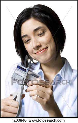 Woman cutting credit card View Large Photo Image Stock Photograph - Woman cutting credit card. Fotosearch