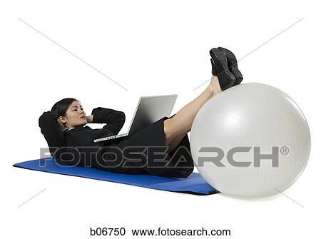 Woman doing yoga with laptop View Large Photo Image Stock Image - Woman doing yoga with laptop. Fotosearch