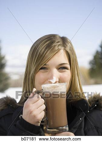 Woman drinking hot chocolate View Large Photo Image Stock Image - Woman drinking hot chocolate. Fotosearch